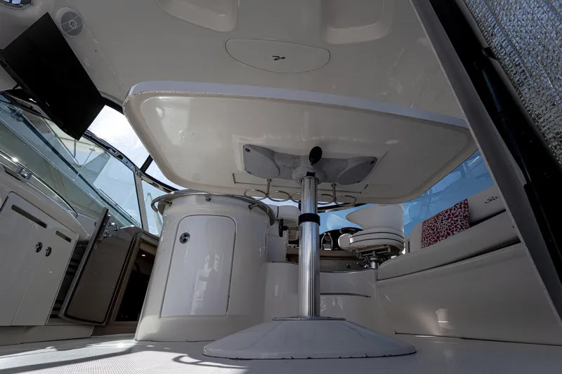 Nauti Lis Yacht Photos Pics Interior view of 2005 Sea Ray 500 Sundancer yacht, featuring seating and table.