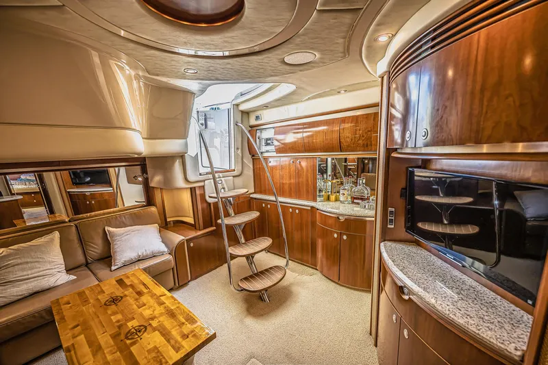 Nauti Lis Yacht Photos Pics Luxurious interior of a 2005 Sea Ray 500 Sundancer yacht with elegant wood finishes.