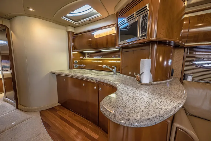 Nauti Lis Yacht Photos Pics Luxurious 2005 Sea Ray 500 Sundancer yacht interior with elegant kitchen and modern amenities.