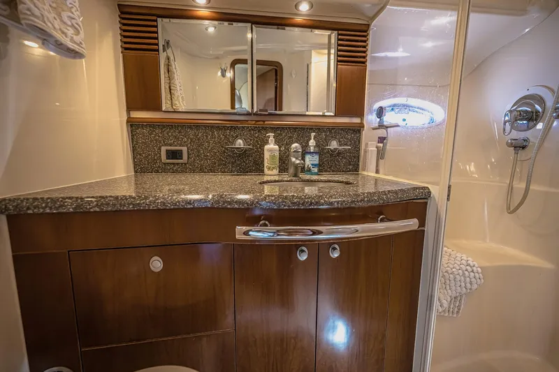 Nauti Lis Yacht Photos Pics Luxurious bathroom in 2005 Sea Ray 500 Sundancer yacht with granite countertop and shower.