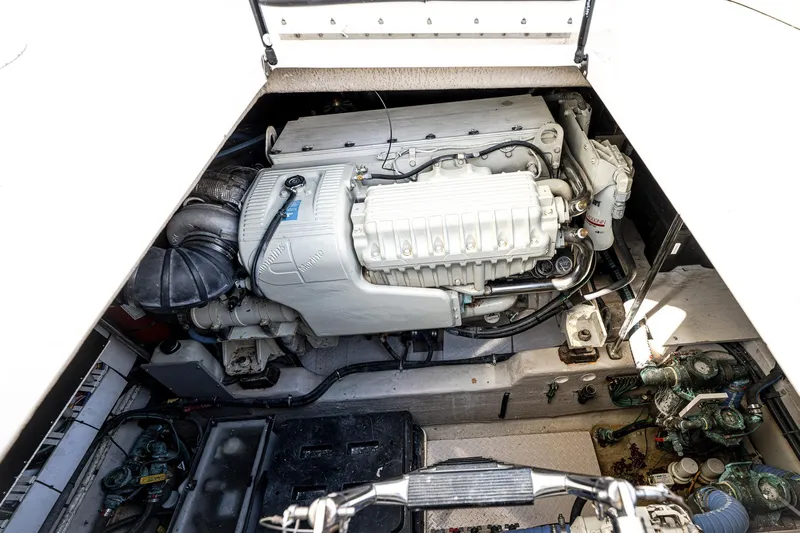 Nauti Lis Yacht Photos Pics Engine compartment of a 2005 Sea Ray 500 Sundancer yacht, showcasing detailed machinery.