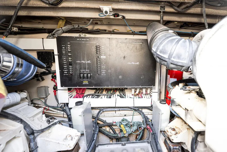 Nauti Lis Yacht Photos Pics Engine room of 2005 Sea Ray 500 Sundancer with control panel and wiring.