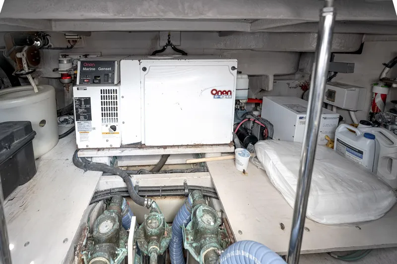 Nauti Lis Yacht Photos Pics Engine room of 2005 Sea Ray 500 Sundancer with Onan Marine Genset and equipment.