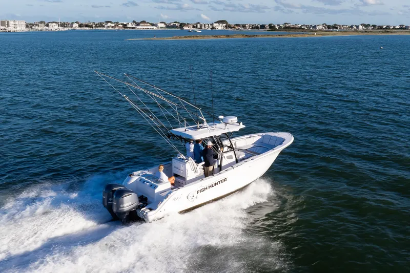 Fish Hunter Yacht Photos Pics 2021 Sea Fox 288 Commander boat cruising on open water.