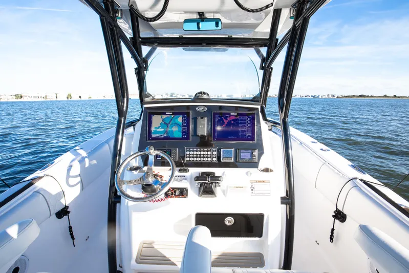 Fish Hunter Yacht Photos Pics 2021 Sea Fox 288 Commander boat dashboard with navigation screens on open water.