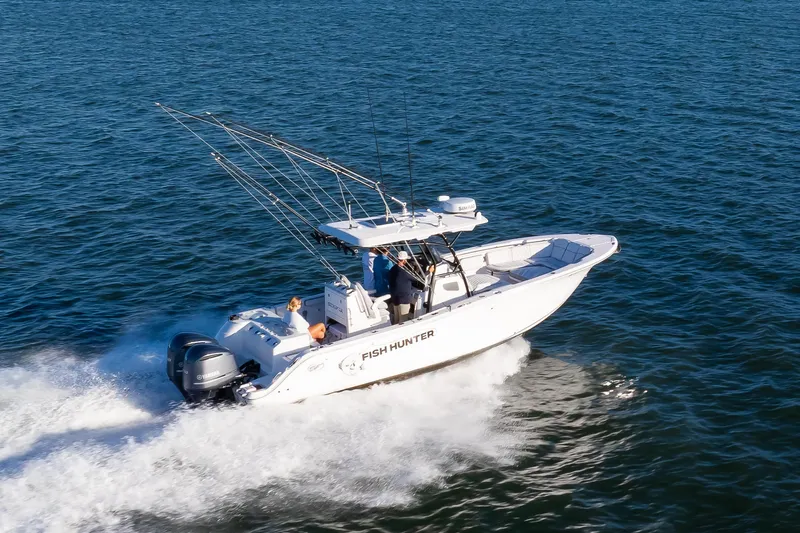 Fish Hunter Yacht Photos Pics 2021 Sea Fox 288 Commander boat cruising on open water.