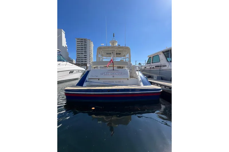 Split Decision Yacht Photos Pics 2007 Chris-Craft Roamer 40 yacht docked, rear view with clear blue sky.