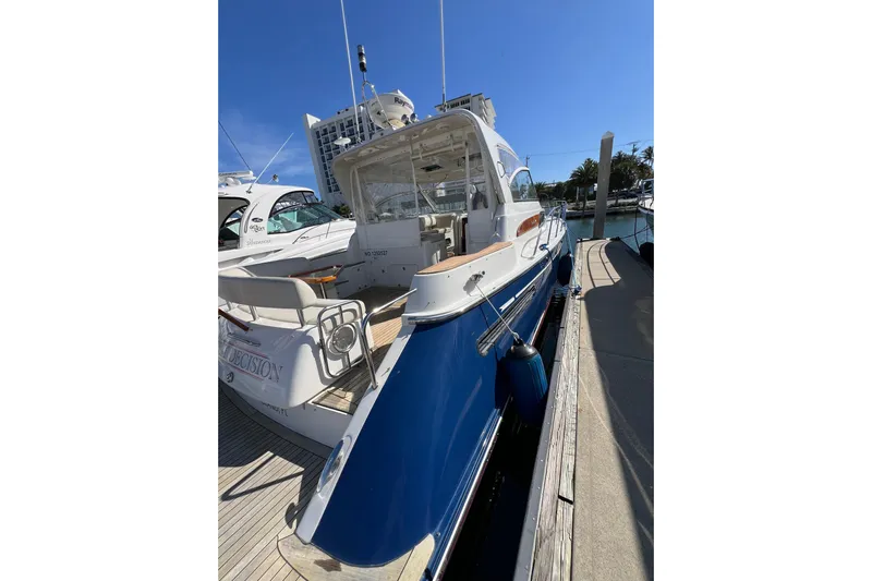 Split Decision Yacht Photos Pics 2007 Chris-Craft Roamer 40 yacht docked, showcasing sleek design and blue hull.