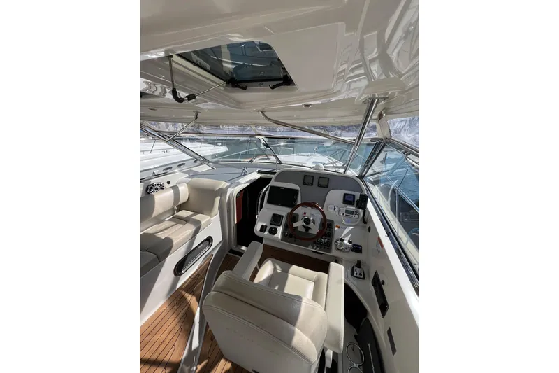 Split Decision Yacht Photos Pics 2007 Chris-Craft Roamer 40 yacht interior with helm, seating, and navigation equipment.