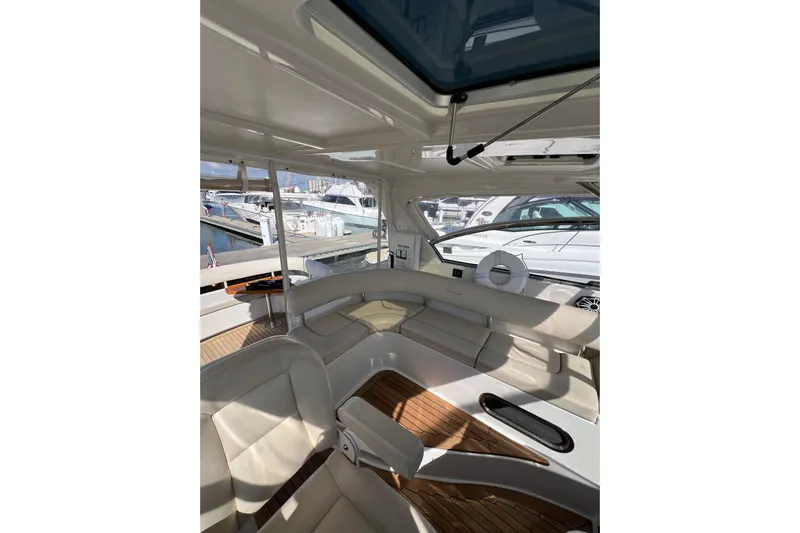 Split Decision Yacht Photos Pics Luxurious interior of 2007 Chris-Craft Roamer 40 yacht with elegant seating and wood flooring.