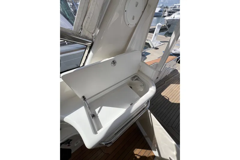 Split Decision Yacht Photos Pics 2007 Chris-Craft Roamer 40 yacht interior with sleek white sink and wooden deck.