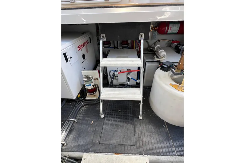 Split Decision Yacht Photos Pics Engine room of 2007 Chris-Craft Roamer 40 with ladder and equipment.