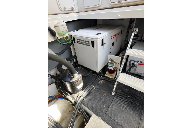 Split Decision Yacht Photos Pics Engine room of 2007 Chris-Craft Roamer 40 with generator and wiring.