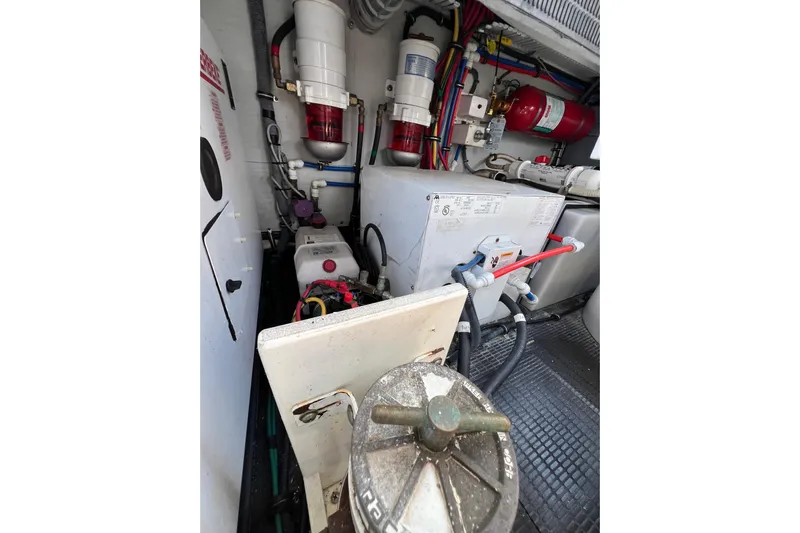 Split Decision Yacht Photos Pics Engine room of 2007 Chris-Craft Roamer 40 with mechanical components and wiring.