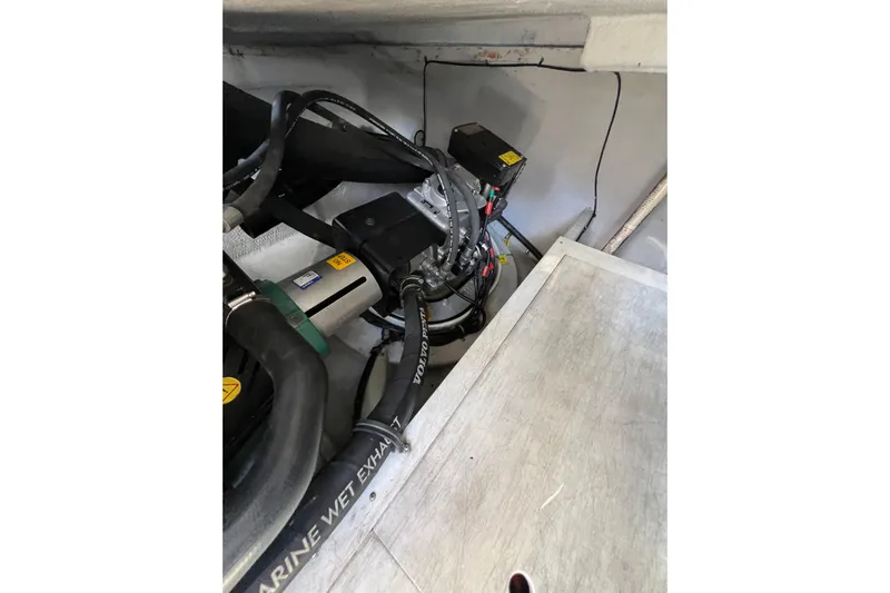 Split Decision Yacht Photos Pics Engine compartment of 2007 Chris-Craft Roamer 40 with visible marine components.