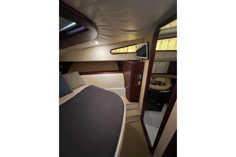 Split Decision Yacht Photos Pics Luxurious interior of 2007 Chris-Craft Roamer 40 yacht with cozy bed and modern amenities.