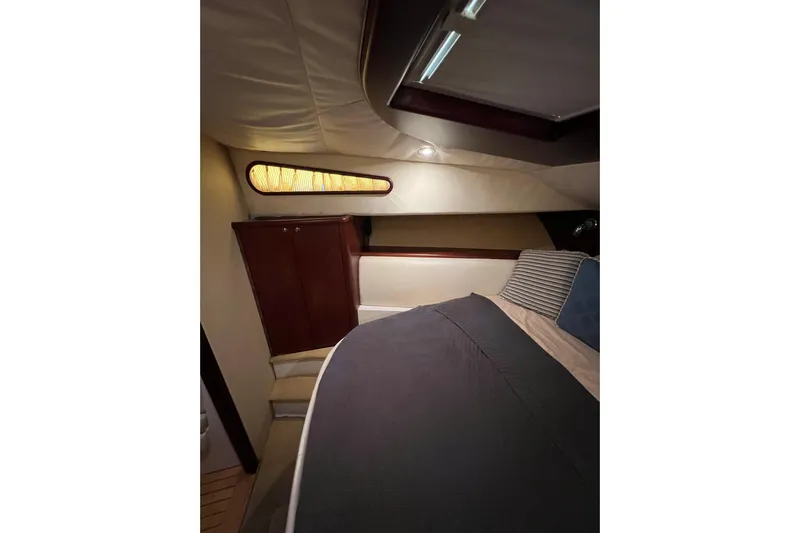 Split Decision Yacht Photos Pics Luxurious cabin interior of 2007 Chris-Craft Roamer 40 yacht with elegant bedding and wood accents.