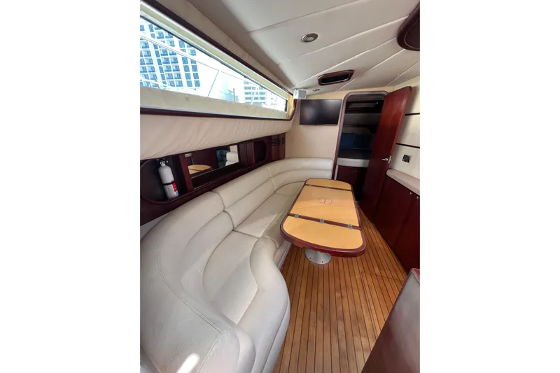 Split Decision Yacht Photos Pics Luxurious interior of 2007 Chris-Craft Roamer 40 yacht with elegant seating and wooden flooring.