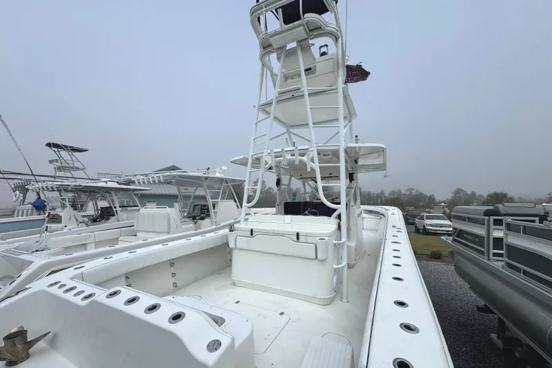  Yacht Photos Pics 2011 Yellowfin 42 Offshore boat with tower, docked in a marina on a foggy day.