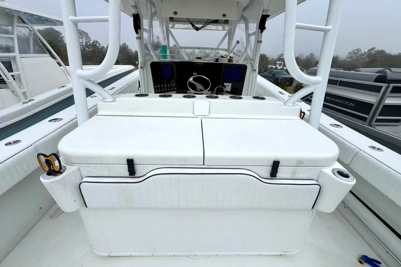  Yacht Photos Pics 2011 Yellowfin 42 Offshore boat console with seating and navigation equipment.