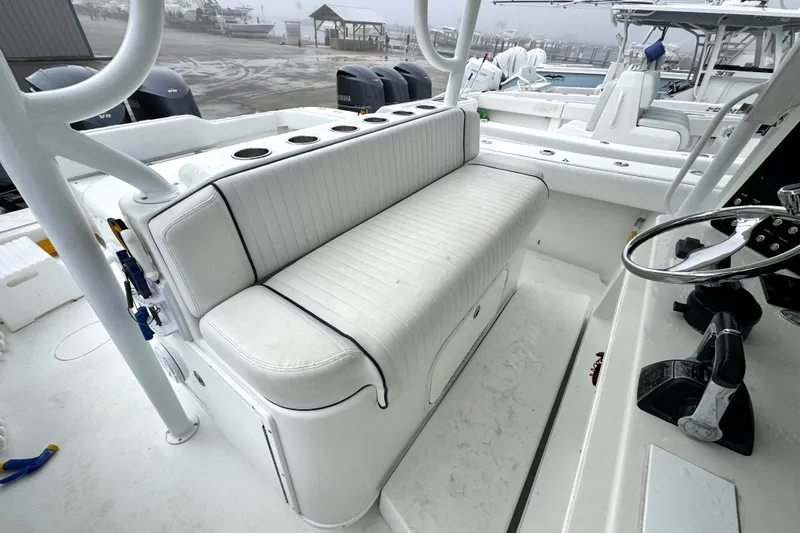  Yacht Photos Pics 2011 Yellowfin 42 Offshore boat interior with white seating and steering wheel.