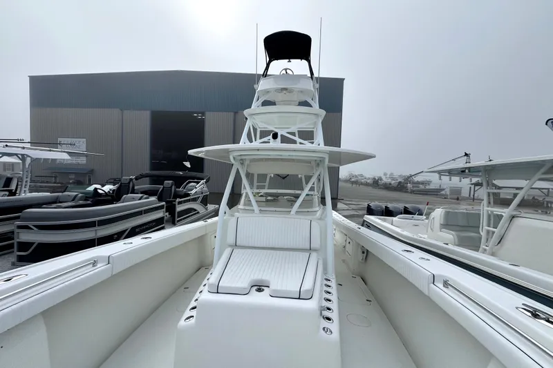  Yacht Photos Pics 2011 Yellowfin 42 Offshore boat at marina, showcasing spacious deck and tower.