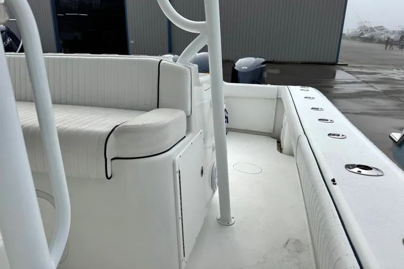  Yacht Photos Pics 2011 Yellowfin 42 Offshore boat interior with white seating and rod holders.