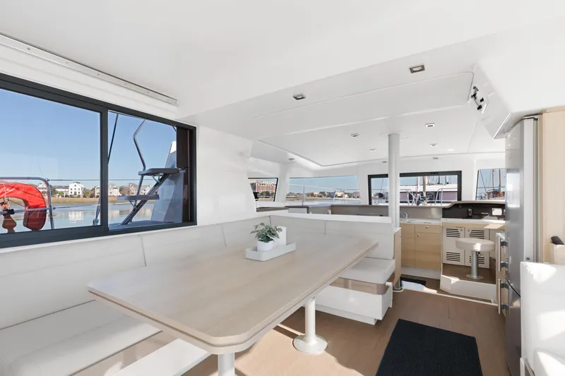 Chasing Shimmer Yacht Photos Pics Modern interior of 2018 Bali 4.0 catamaran with spacious seating and panoramic windows.