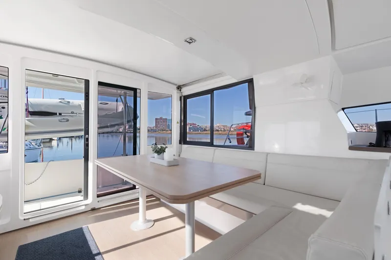 Chasing Shimmer Yacht Photos Pics Interior of 2018 Bali 4.0 catamaran with spacious seating and waterfront view.