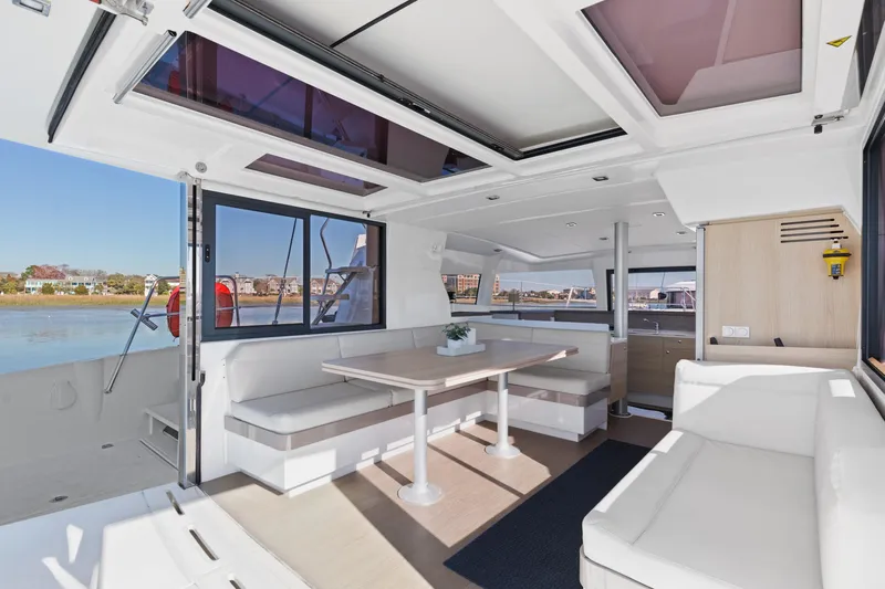 Chasing Shimmer Yacht Photos Pics Spacious interior of 2018 Bali 4.0 catamaran with modern seating and dining area.