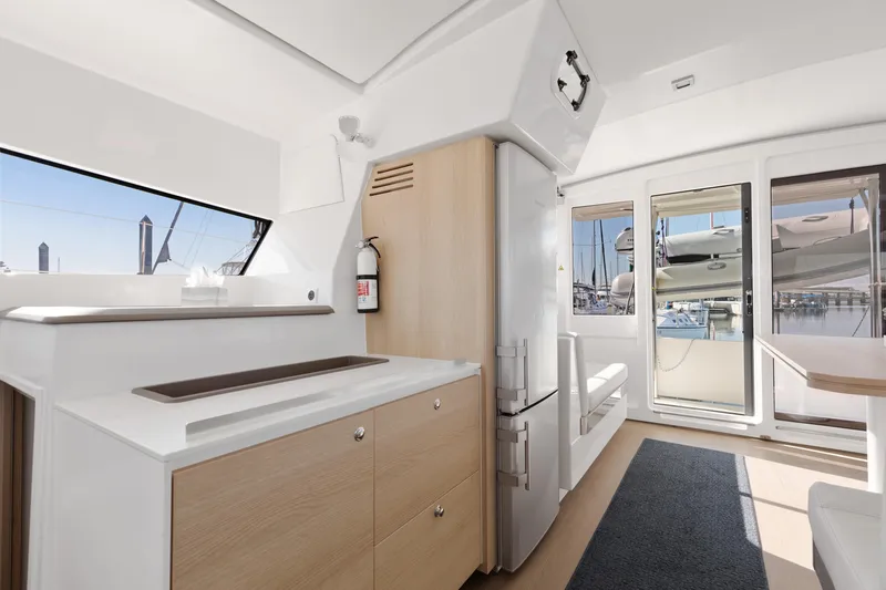 Chasing Shimmer Yacht Photos Pics Modern interior of 2018 Bali 4.0 yacht with sleek kitchen and marina view.