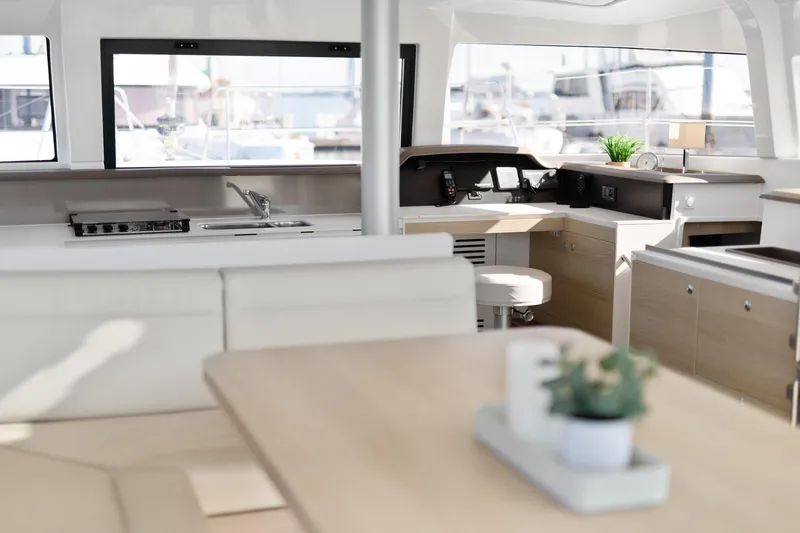 Chasing Shimmer Yacht Photos Pics Modern interior of 2018 Bali 4.0 yacht with kitchen and navigation area.