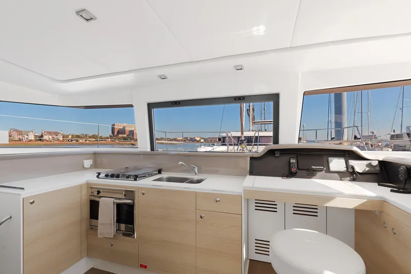 Chasing Shimmer Yacht Photos Pics Modern kitchen interior on 2018 Bali 4.0 catamaran with marina view.