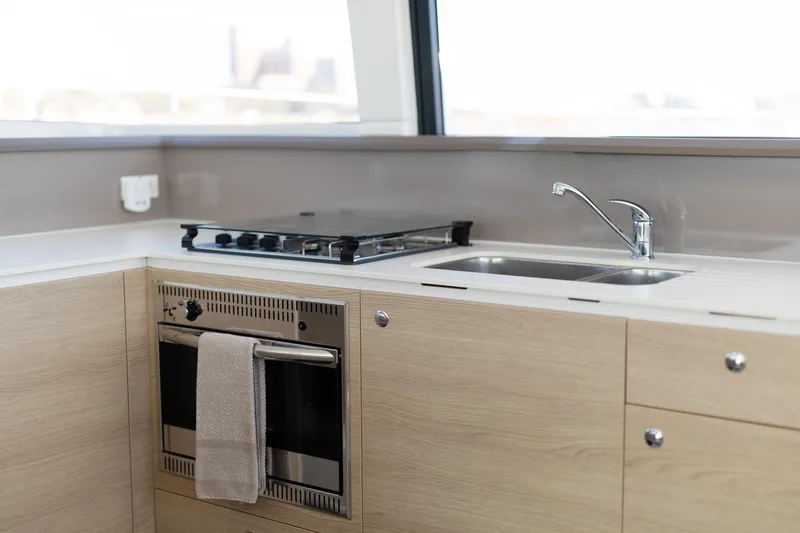 Chasing Shimmer Yacht Photos Pics Modern kitchen in 2018 Bali 4.0 yacht with stove, oven, and sink.