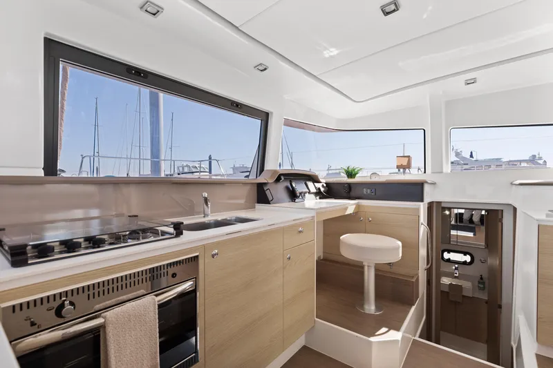 Chasing Shimmer Yacht Photos Pics Modern kitchen interior of 2018 Bali 4.0 yacht with sleek design and ample natural light.