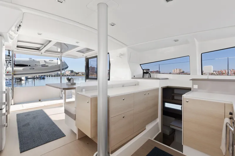 Chasing Shimmer Yacht Photos Pics Interior of 2018 Bali 4.0 catamaran with modern kitchen and marina view.
