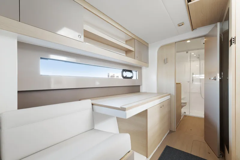 Chasing Shimmer Yacht Photos Pics Modern interior of 2018 Bali 4.0 yacht with sleek design and compact bathroom.