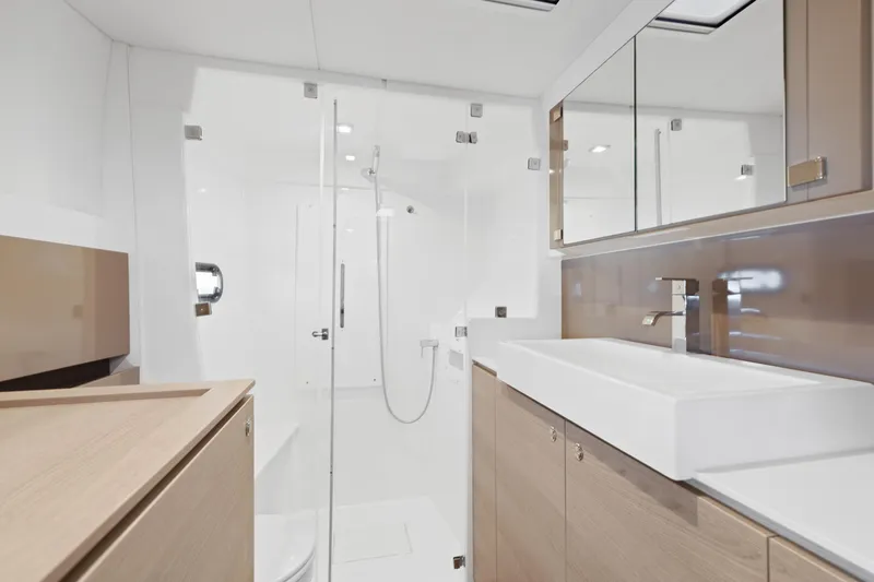 Chasing Shimmer Yacht Photos Pics Modern yacht bathroom with sleek design, featuring glass shower and elegant fixtures, Bali 4.0, 2018.