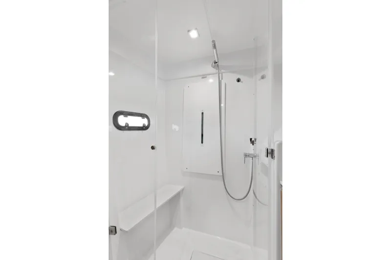 Chasing Shimmer Yacht Photos Pics Modern shower cabin in Bali 4.0, 2018 model, featuring sleek design and white interior.