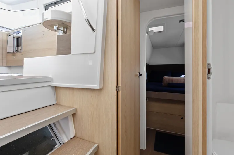 Chasing Shimmer Yacht Photos Pics Interior of 2018 Bali 4.0 yacht, featuring modern cabin and wooden finishes.