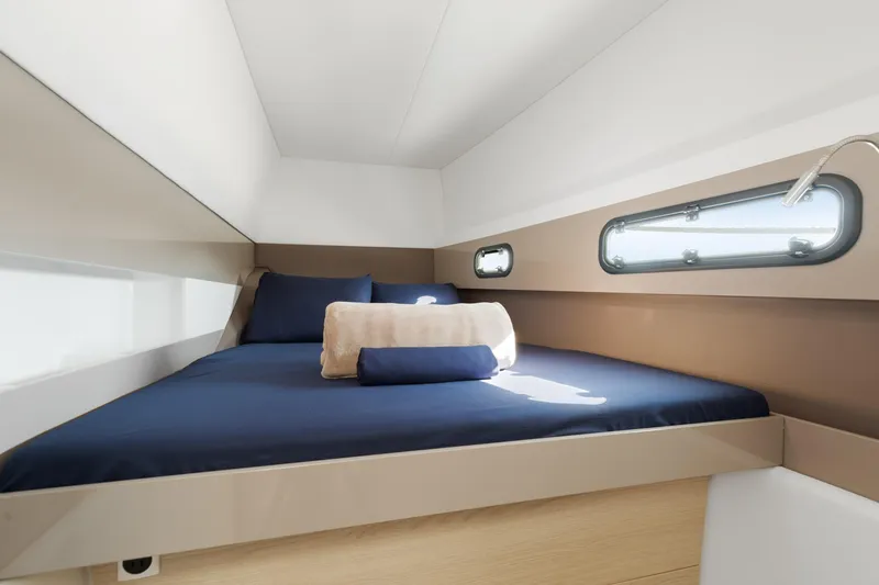 Chasing Shimmer Yacht Photos Pics Luxurious cabin interior of 2018 Bali 4.0 yacht with cozy bedding and modern design.