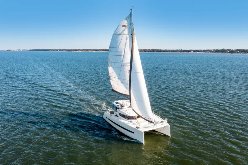 Chasing Shimmer Yacht Photos Pics Sailing catamaran Bali 4.0, 2018 model, cruising on open water under clear blue skies.
