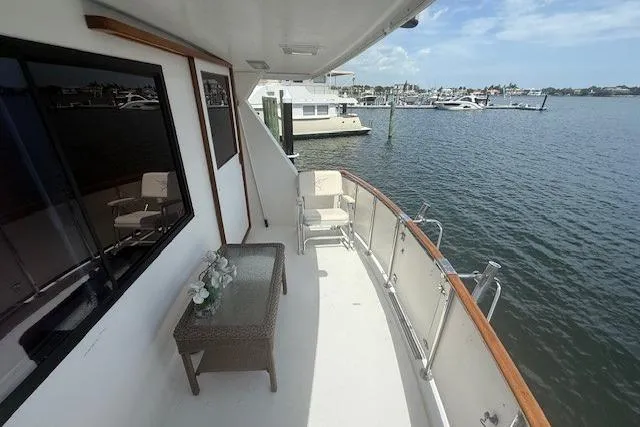 Sweet Caroline Yacht Photos Pics 1989 Jefferson Marquessa 52 yacht deck with seating, overlooking marina and water.