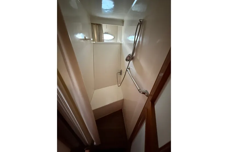 Sweet Caroline Yacht Photos Pics Compact shower area in 1989 Jefferson Marquessa 52 yacht with handheld showerhead.