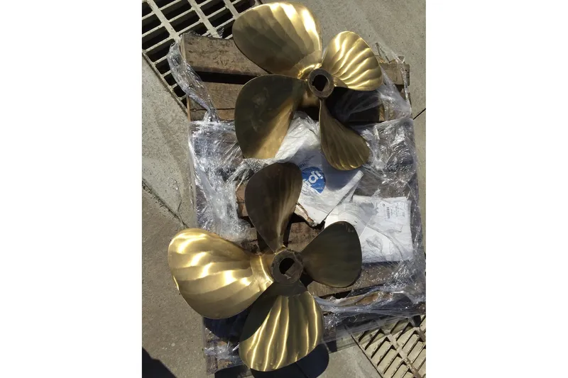 Sweet Caroline Yacht Photos Pics Brass propellers for 1989 Jefferson Marquessa 52 yacht on wooden pallet.