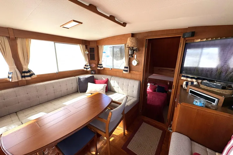Deja Vu Yacht Photos Pics Interior of 1993 Grand Banks 42 Classic yacht with cozy seating and elegant wood finish.