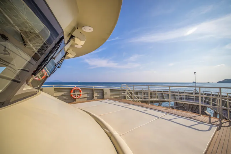 Vanora Yacht Photos Pics Luxurious 2023 Seacrest Marine 52m Yacht deck with ocean view and clear skies.