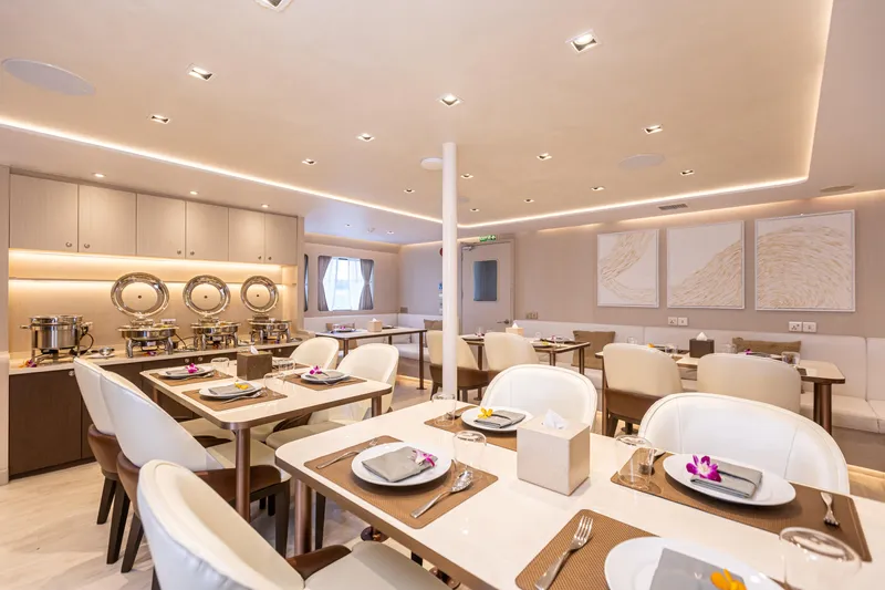 Vanora Yacht Photos Pics Luxurious dining area on 2023 Seacrest Marine 52m Yacht, featuring elegant decor and table settings.