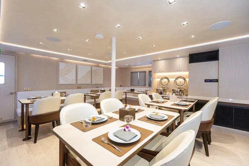 Vanora Yacht Photos Pics Luxurious dining area on 2023 Seacrest Marine 52m Yacht, featuring elegant table settings.