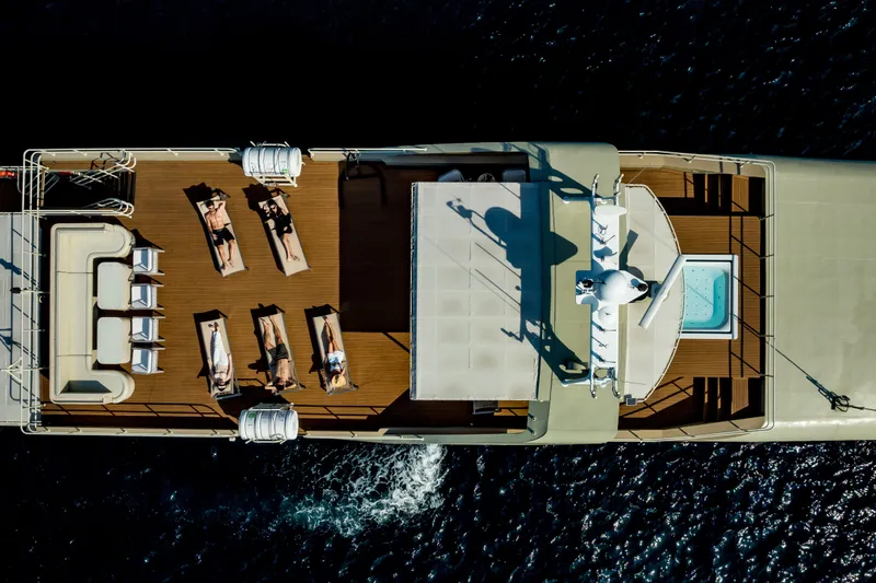 Vanora Yacht Photos Pics Aerial view of 2023 Seacrest Marine 52m yacht with sunbathers and jacuzzi.